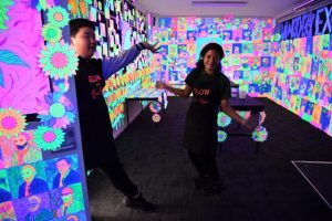 Kids’ art work glows with flaming flowers and swirling clouds